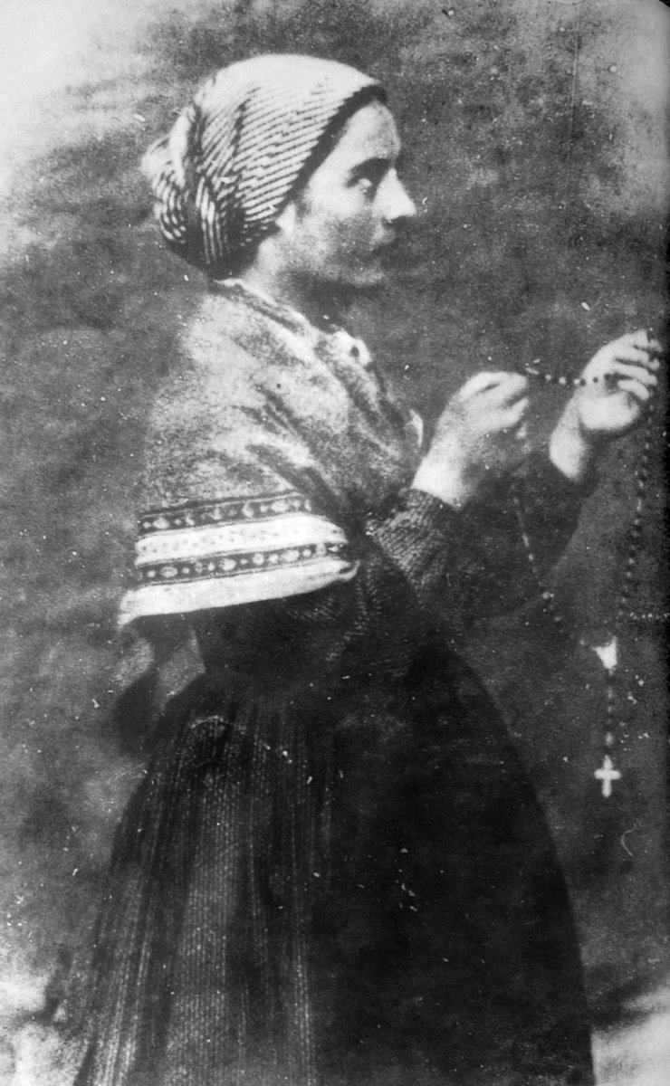 Bernadette Soubirous, 1861, photograph by Bernadou. She holds her rosary in profile.