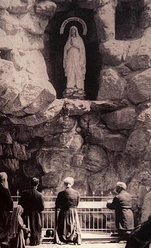 Pilgrims at prayer before the Grotto of Massabielle, c.1896.